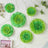 Green floral wall decorations in various sizes on a light background.