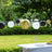 Decorative hanging lanterns in black, white, and gold for outdoor celebrations.