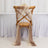 Wooden chair draped with sheer fabric in soft brown and beige tones.