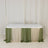 Table draped in green and cream fabric for events or decor
