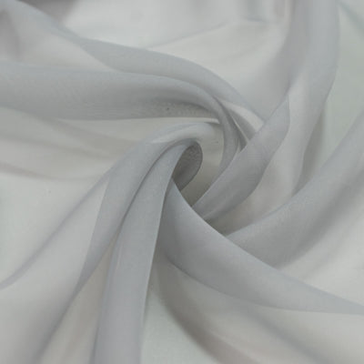 Sheer white fabric close-up with elegant swirling folds#whtbkgd