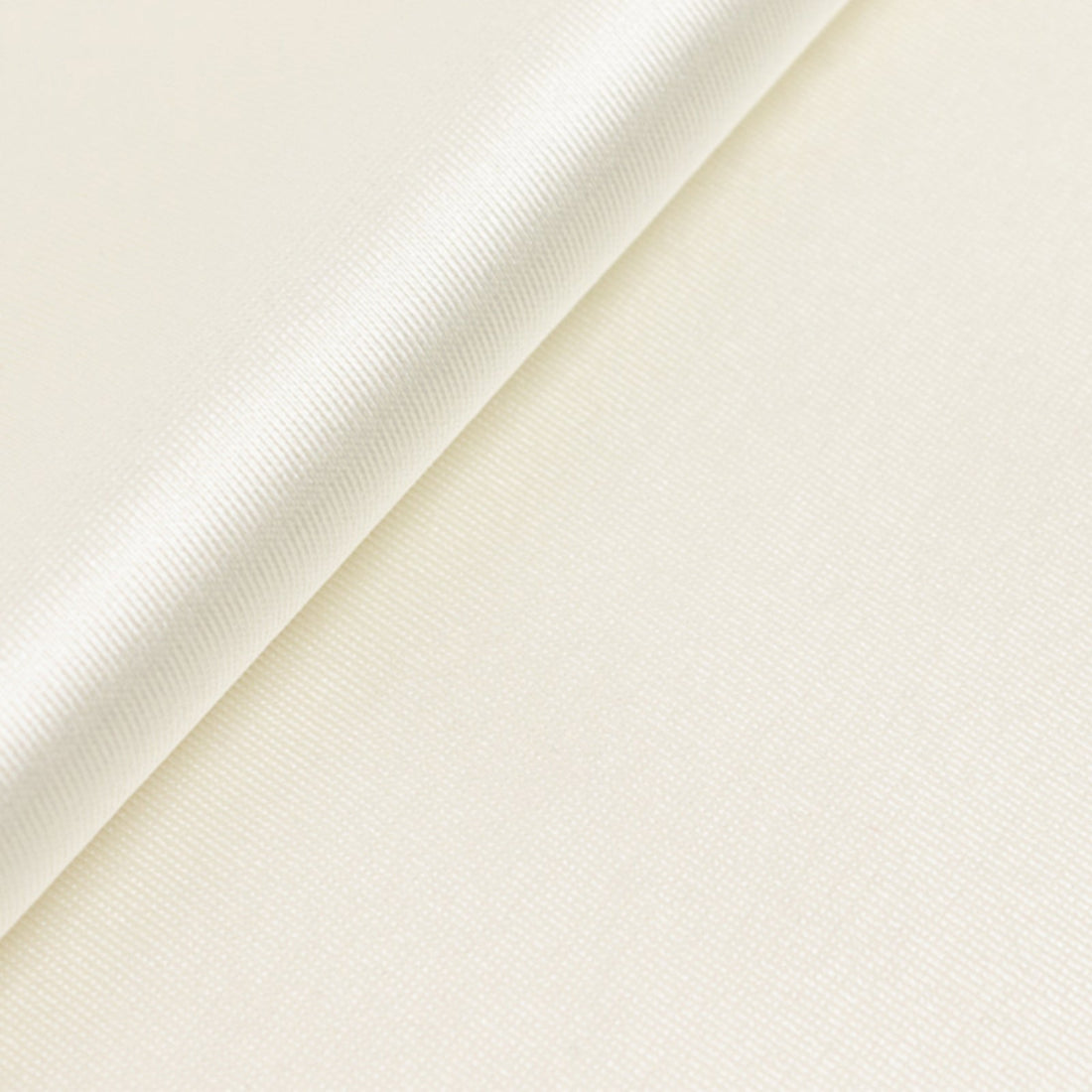 Cream textured fabric close-up showing smooth surface details.