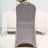 Sparkling silver dining chair on a white table setting.