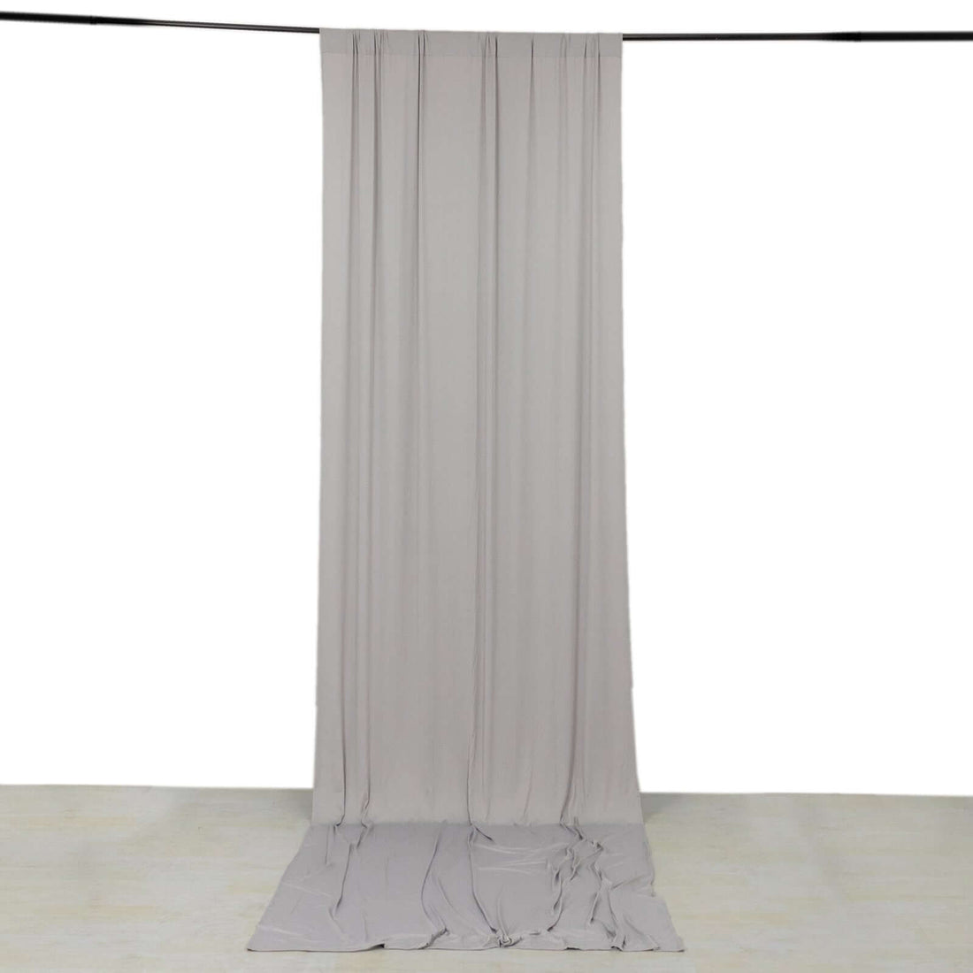 Gray fabric backdrop draped elegantly for photography purposes