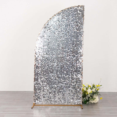 Silver sequined backdrop with a curved design for event decor.