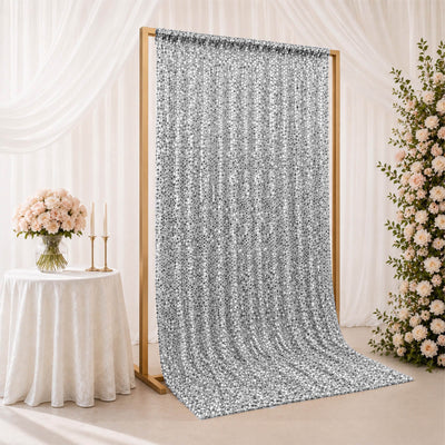 Silver sequin backdrop curtain for wedding and event decor with floral accents