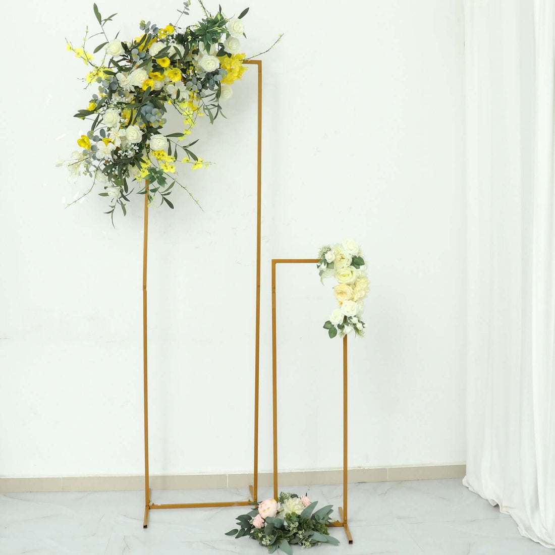 Floral display stand with vibrant flowers in a minimalist setting
