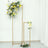 Floral display stand with vibrant flowers in a minimalist setting