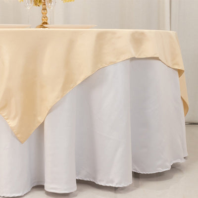 Elegant cream tablecloth draping over a white table for special occasions.