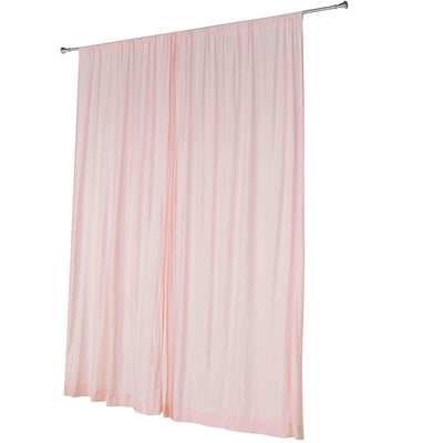 Pink sheer curtain panel hanging on rod for window treatments