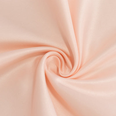 Peach satin fabric with a smooth, flowing texture. #whtbkgd