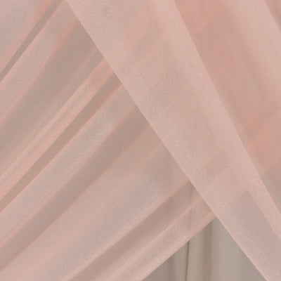 Soft pink sheer fabric draped elegantly, showcasing delicate texture. #whtbkgd