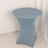 Blue stretch table cover for round tables in a studio setting.