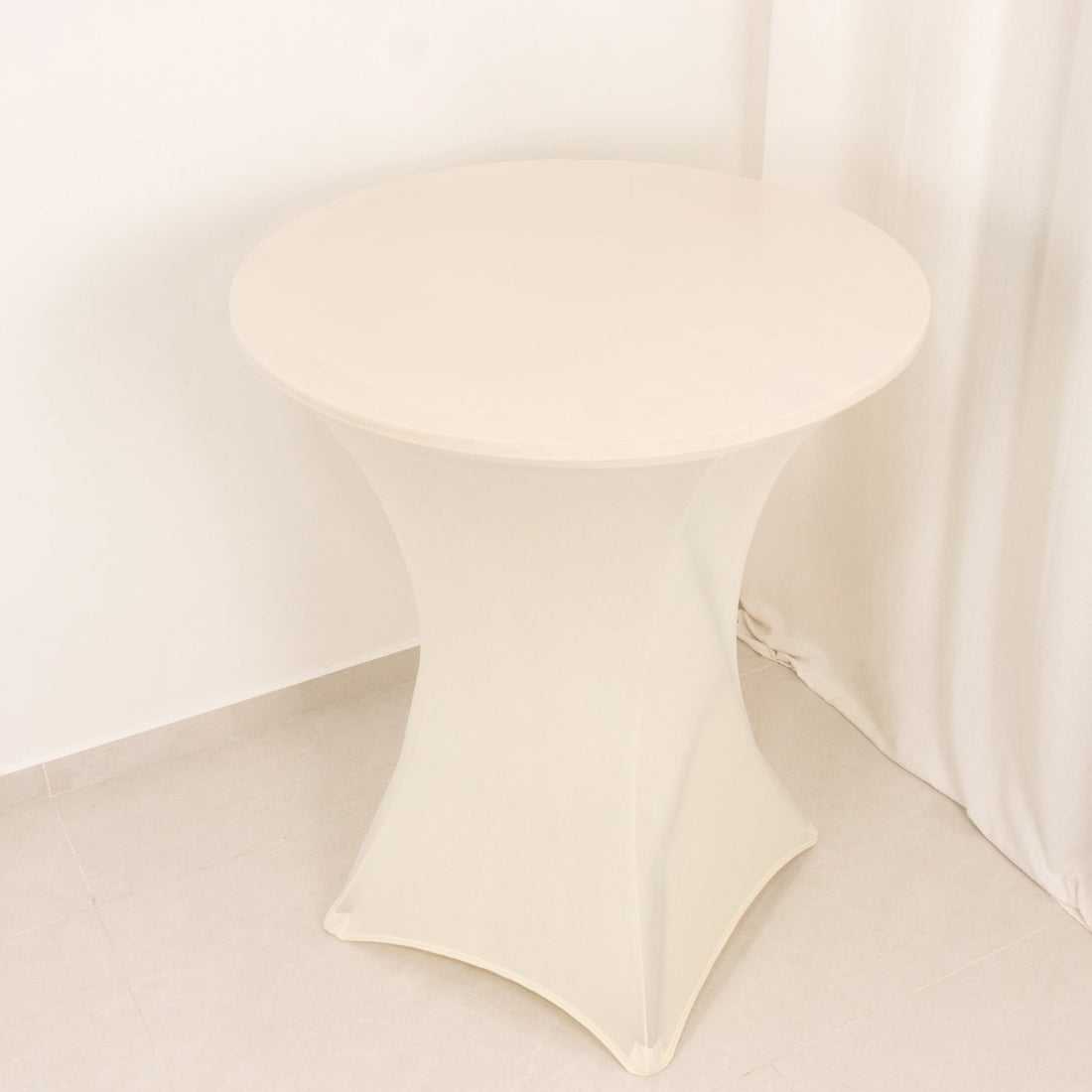 Round white table with a unique base design