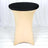 Black round table with a beige stretch cover on a white backdrop