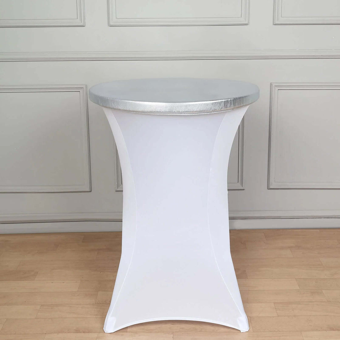 White cocktail table with silver trim, ideal for events and gatherings.