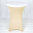 Beige stretch table cover on a round table with a white top.