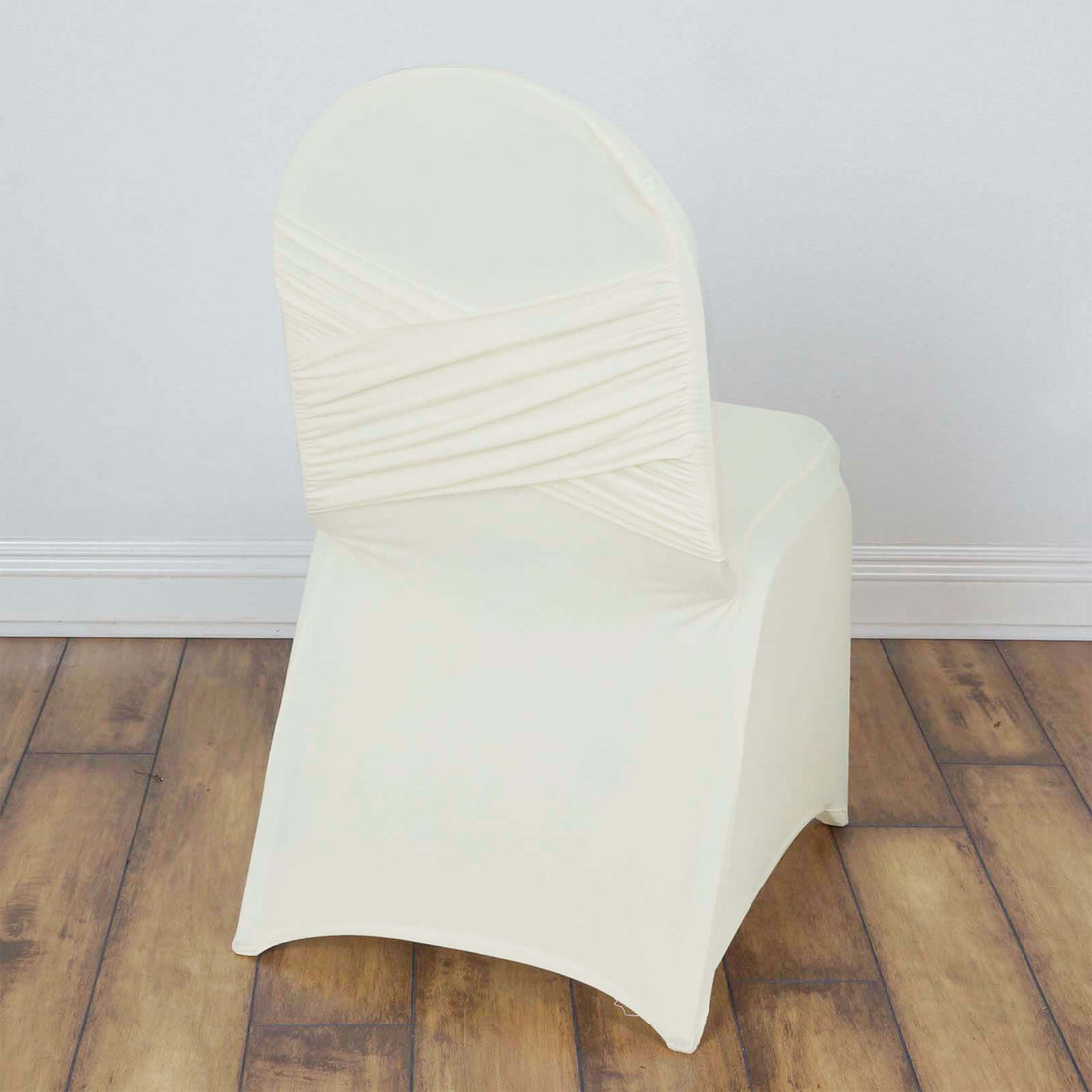 Ivory chair cover with ruched back design for elegant events