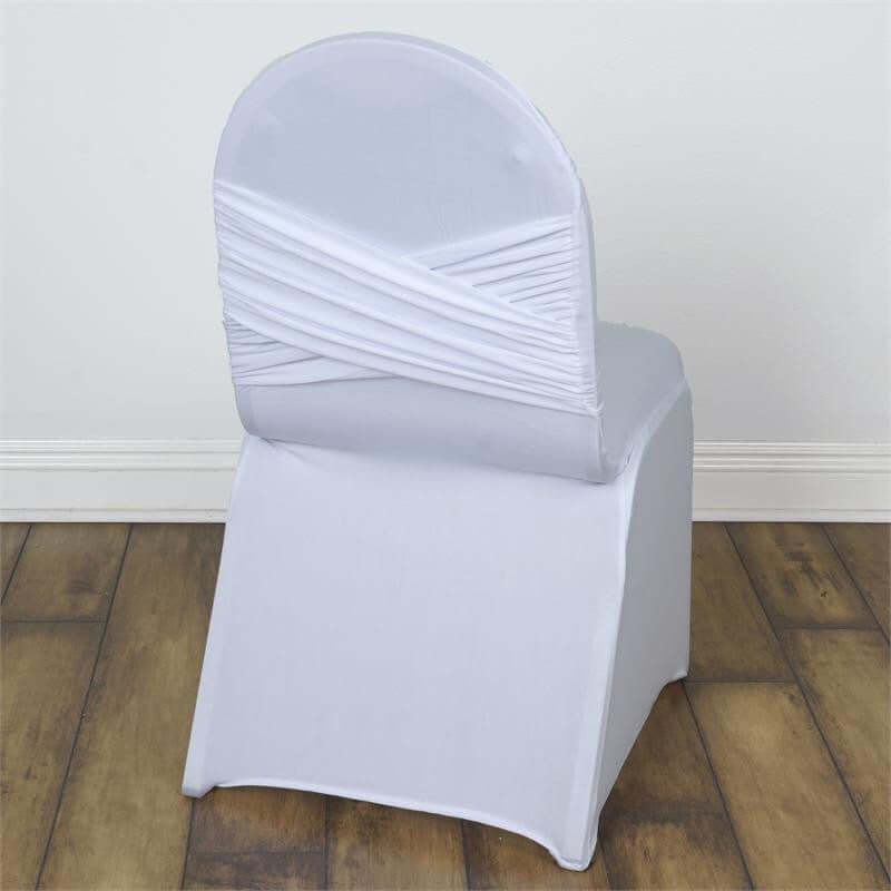 White chair cover with crisscross back design, isolated on a plain backdrop.