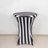 Striped table cover with black and white design on a plain backdrop