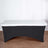 Black table cover with white top on a wooden floor.