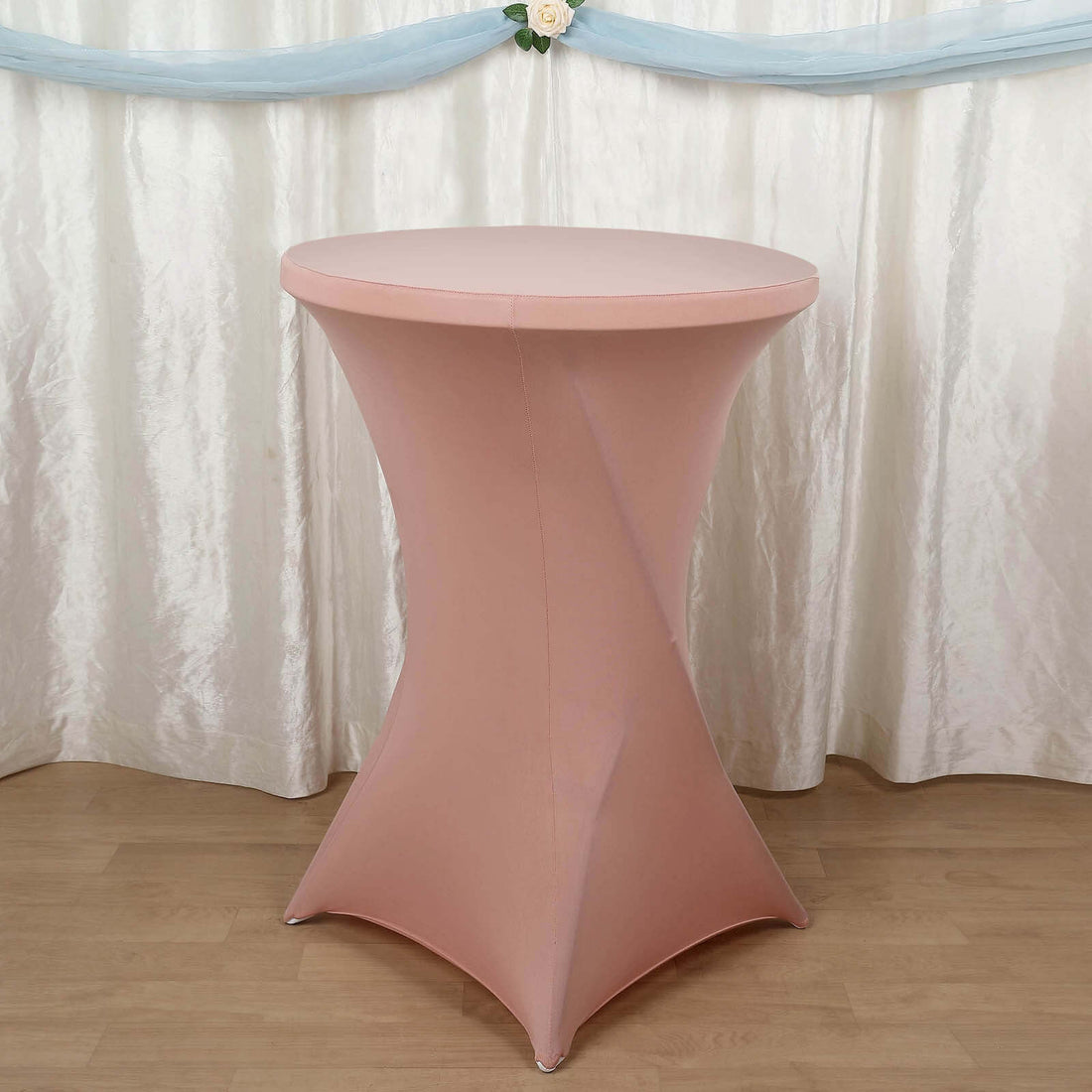 Pink cocktail table with a sleek design against a soft backdrop.