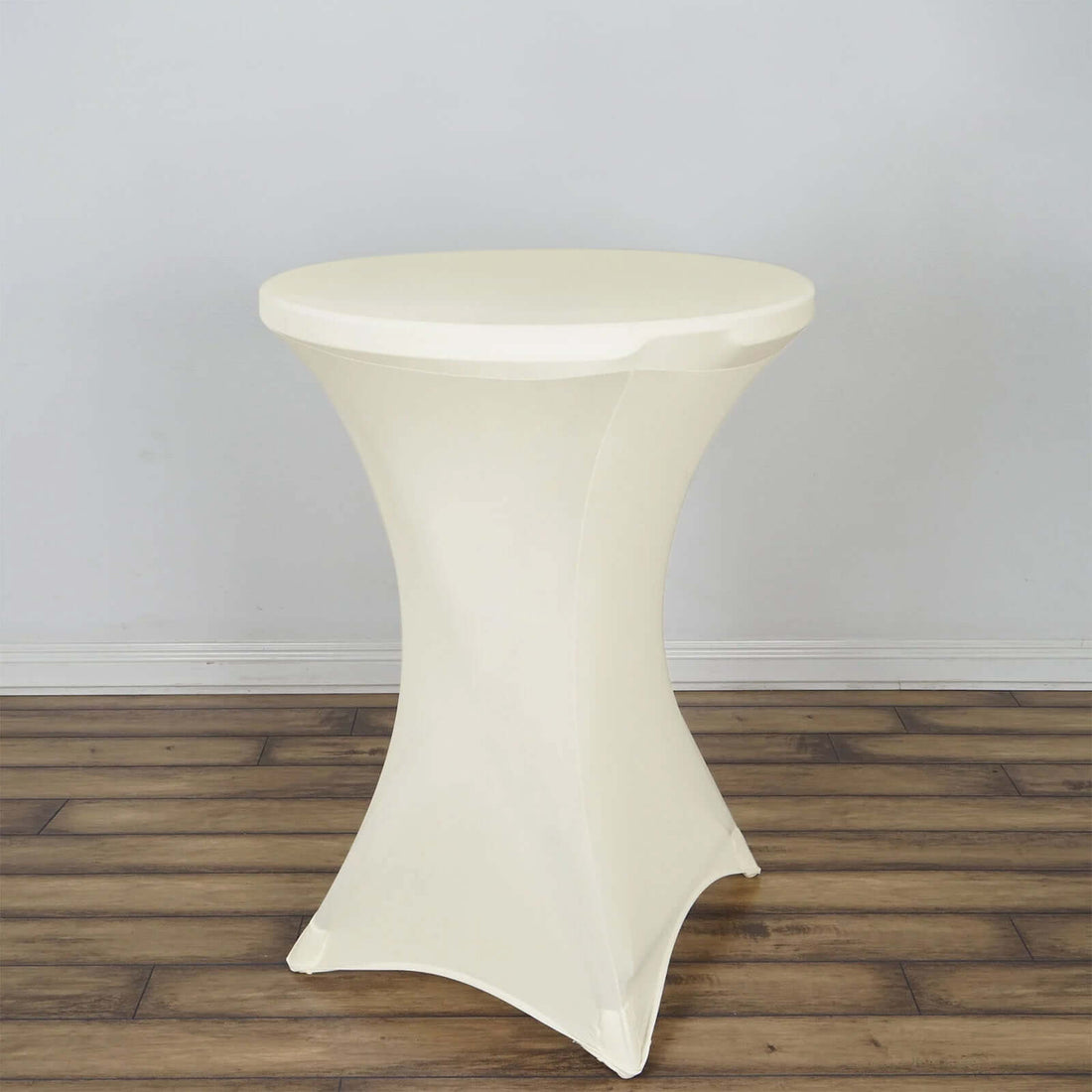 Ivory cocktail table with a sleek design and curved base