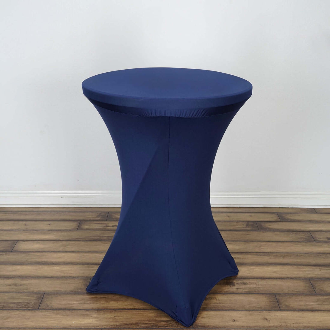 Navy blue stretch table cover on a circular table
