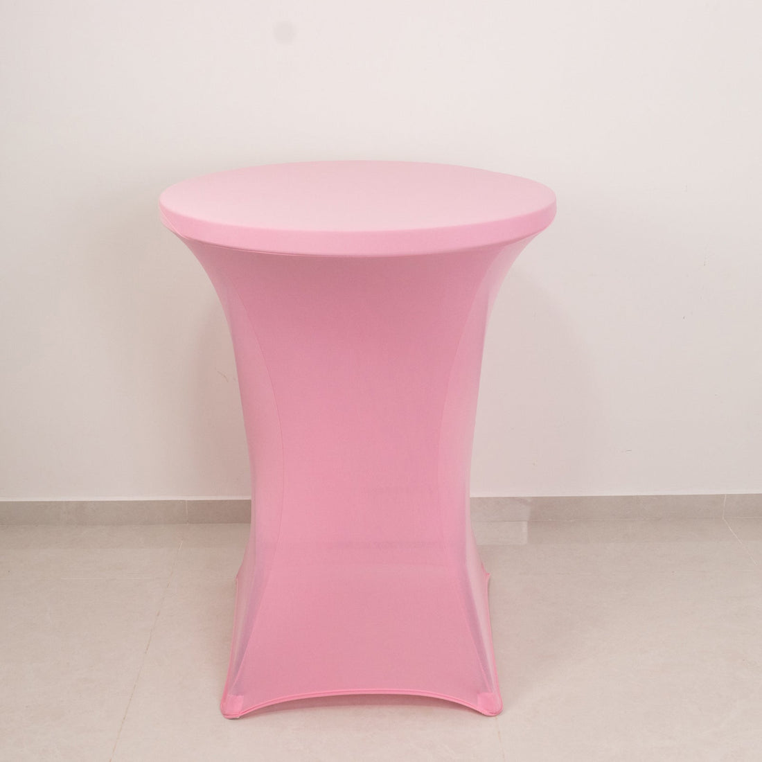 Pink round table with a modern design.
