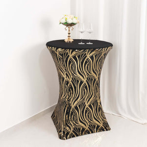 Elegant black table cover with gold leaf design for events and gatherings.