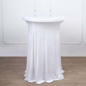 White stretch table cover on a cocktail table with two glasses.