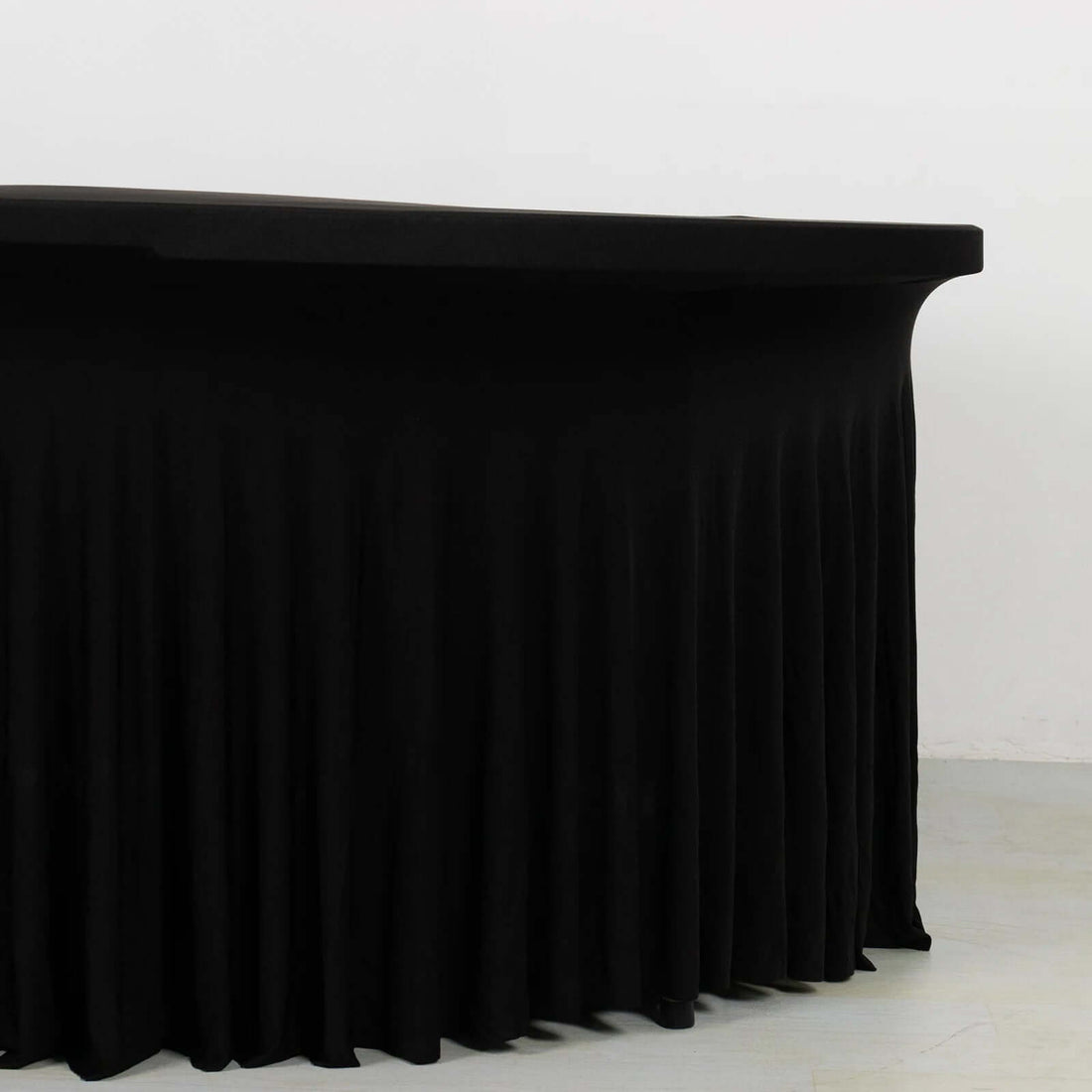 Black table with pleated skirt for events and gatherings