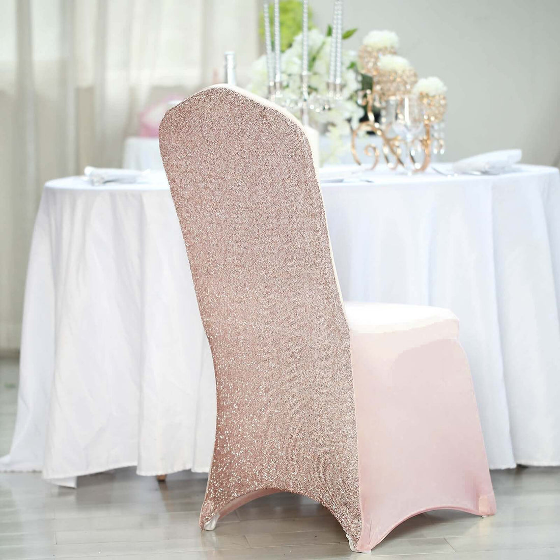 Sparkling pink chair cover at an elegant dining setup.