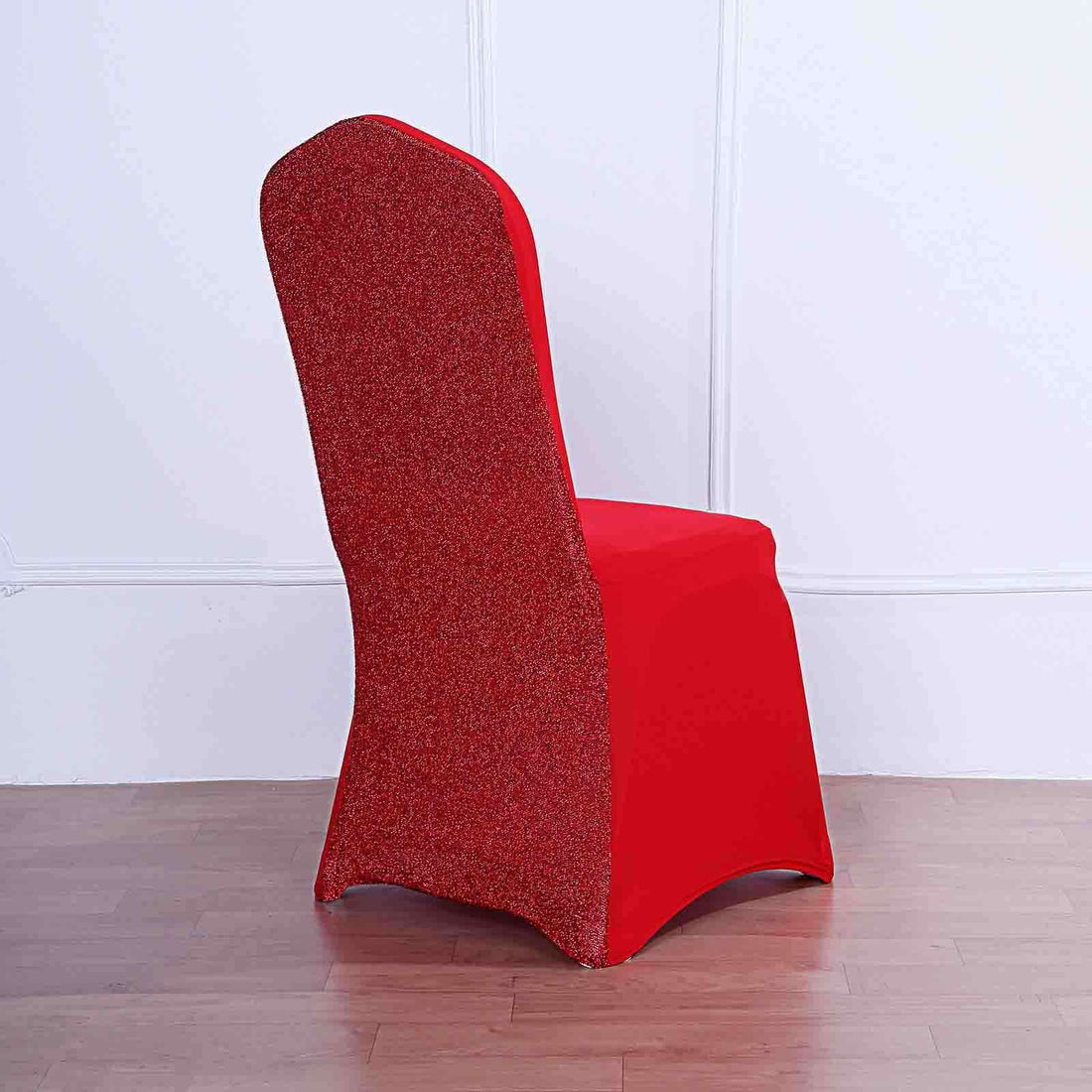 Red chair with glittery back on a plain background.