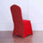 Red chair with glittery back on a plain background.