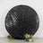 Black sequin round backdrop with floral accents