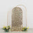 Gold sequin backdrop with arch frame and floral arrangements at the base.