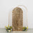 Gold sequin backdrop with floral accents and arched frame