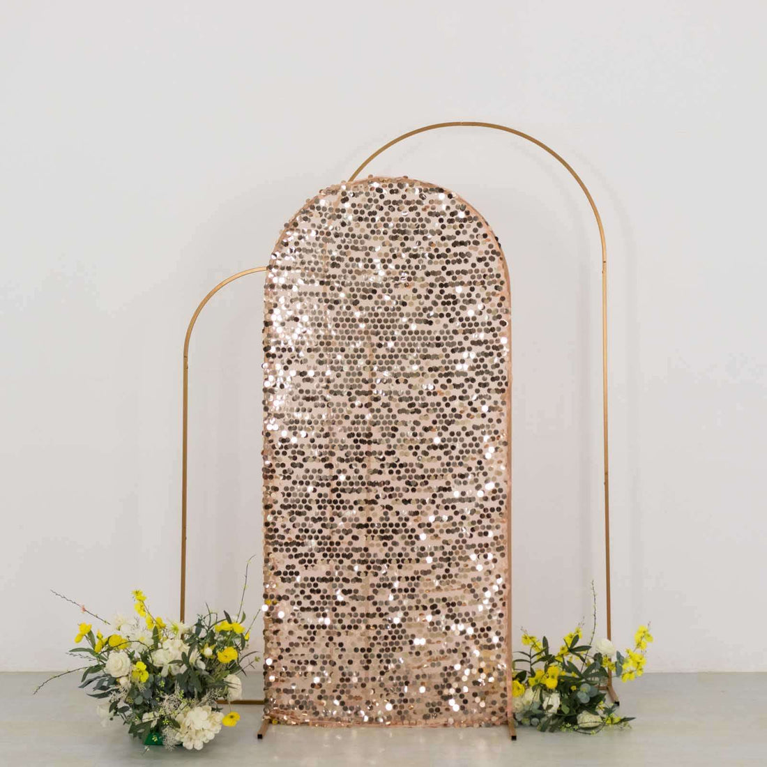 Sequin backdrop with gold frame and floral arrangements