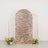 Rose gold sequined backdrop with floral arrangements.