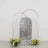 Decorative mirror with a floral arrangement in front