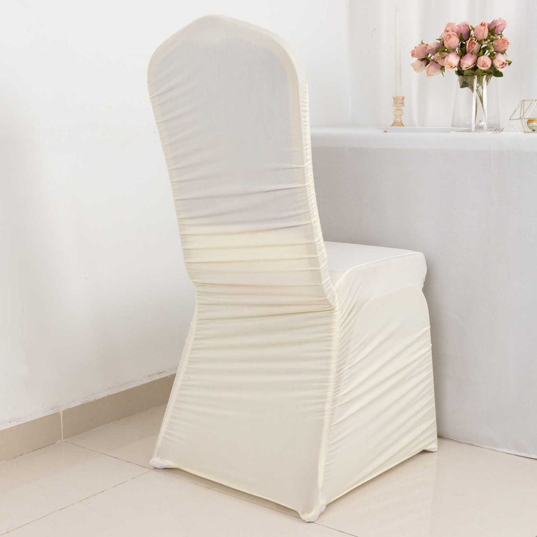Elegant cream chair cover for weddings and events.