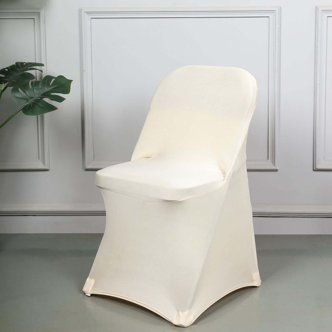 Cream-colored stretch chair cover for events and décor.