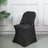 Black stretch chair cover on a modern chair in a stylish setting.