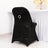 Black chair cover with elegant bow detail, perfect for events and weddings.