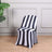 Black and white striped chair cover in a modern setting.