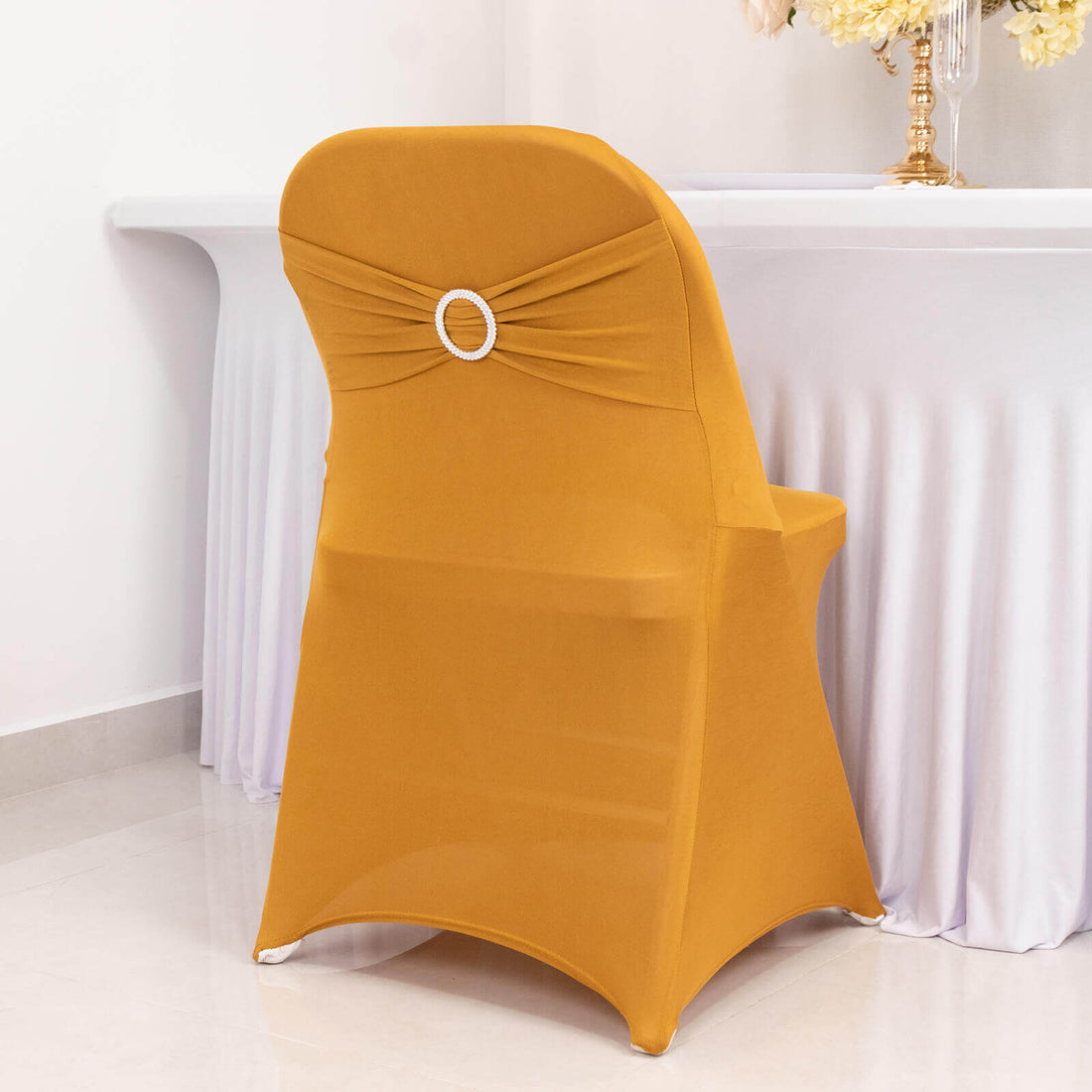 Elegant mustard chair cover with decorative back detail