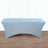Blue stretch table cover on a wooden floor.