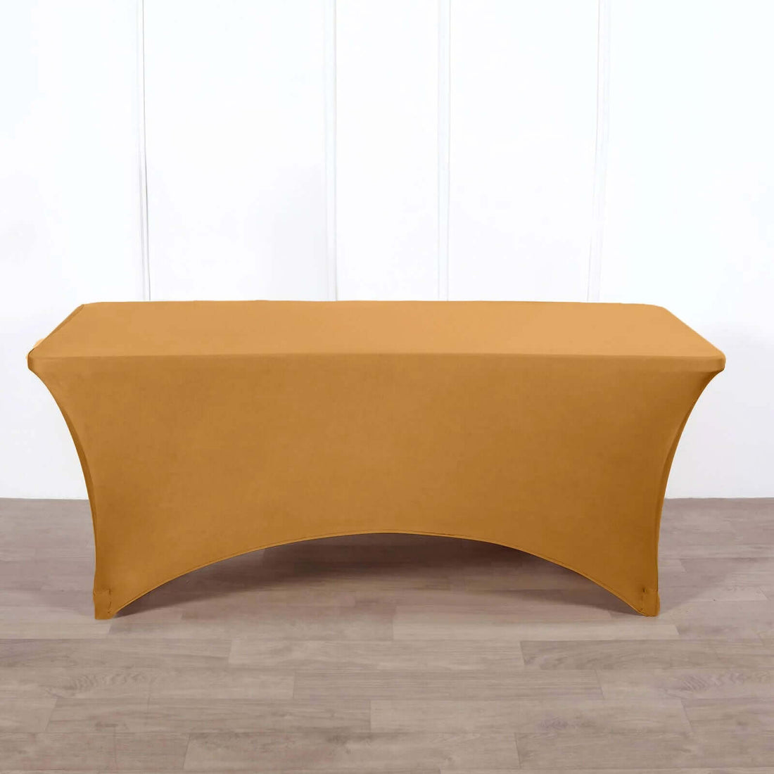 Golden table cover on a plain backdrop
