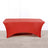 Red table cover on a plain backdrop for event styling.